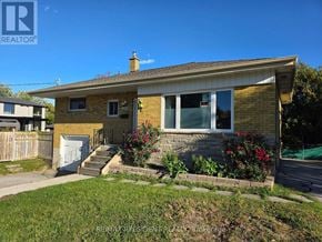 Burlington (Mountainside) apartment for rent - A house with a brown brick exterior and a white door.