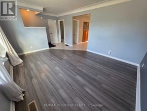 Burlington (Mountainside) apartment for rent - A room with wooden flooring and a grey wall.
