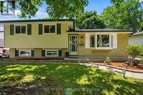 London East (East C) apartment for rent - A yellow house with a green door and windows.