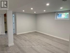 St. Catharines (Bunting/Linwell) apartment for rent - A spacious room with light grey flooring and white walls, with a window on the right wall.
