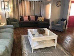 Niagara Falls (Hospital) apartment for rent - A living room with a couch, armchairs, and a coffee table.