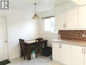 Toronto (Hillcrest Village) apartment for rent - A dining room with a table and chairs.