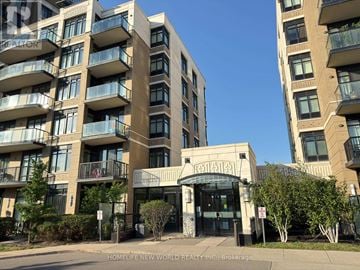 Markham (Unionville) condo for rent - A building with the sign "HOMELIFE NEW WORLD REALTY INC" in front of it.