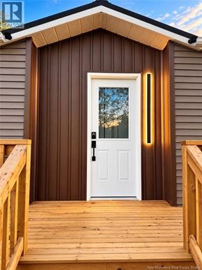 Bethel apartment for rent - A small house with a white door and a wooden deck.