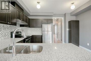 Markham (Greensborough) townhouse for rent - A kitchen with a sink and a refrigerator.