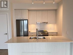 Mississauga (Creditview) condo for rent - A kitchen with a stainless steel refrigerator and a white countertop.