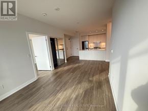 Mississauga (Creditview) condo for rent - A spacious room with wooden flooring and white walls.