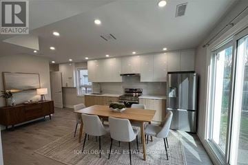 Toronto (L'amoreaux) apartment for rent - A modern kitchen with a dining table and chairs.