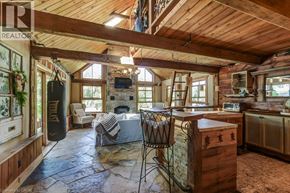 Hamilton apartment for rent - A living room with a stone floor and wooden ceiling.