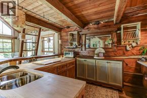 Hamilton apartment for rent - A kitchen with wooden cabinets and a wooden ceiling.