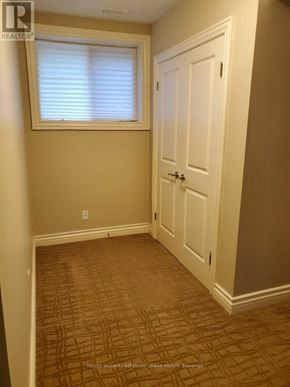 Toronto (Englemount-Lawrence) apartment for rent - A room with a door and a window.