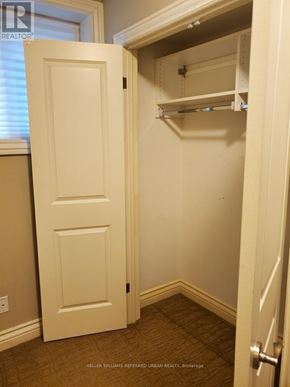 Toronto (Englemount-Lawrence) apartment for rent - A white door is open to a small closet with shelves.