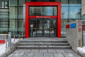 Toronto (Mount Pleasant West) condo for rent - The entrance to a building with a red door and glass windows.