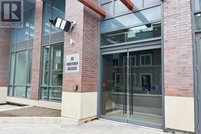 Vaughan (Vaughan Corporate Centre) condo for rent - The entrance to a building with a glass door and a sign that reads "60 Honeycrest Crescent".