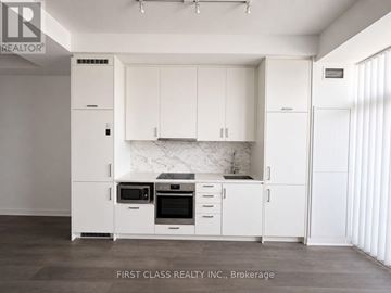 Vaughan (Vaughan Corporate Centre) condo for rent - A kitchen with white cabinets and appliances in a brokerage.