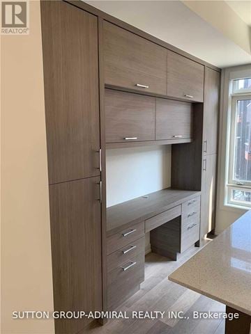 Richmond Hill (Langstaff) townhouse for rent - A kitchen with a counter top and cabinets.