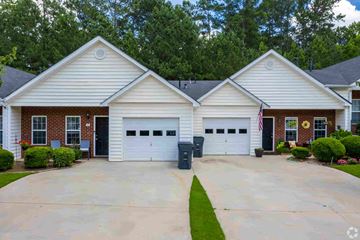 Newnan apartment for rent - A two-story house with a garage and a driveway.