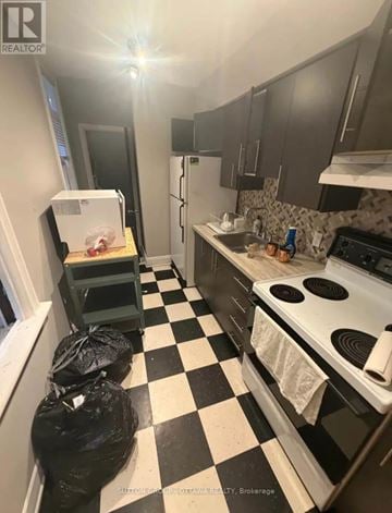 Ottawa triplex for rent - A black and white checkered floor in a kitchen.