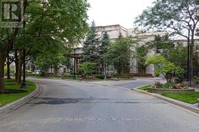 Mississauga (Hurontario) condo for rent - A street view with a RE/MAX Realty sign on a pole.