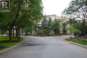 Mississauga (Hurontario) condo for rent - A street with a sign that says RE/MAX Realty Specialists Inc. Brokerage.