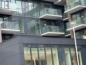 Newmarket (Central Newmarket) condo for rent - A modern building with balconies and a glass facade.