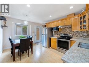 Burnaby apartment for rent - A kitchen with wooden cabinets and a granite countertop.