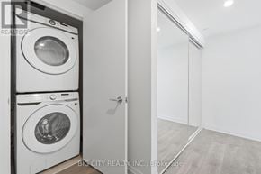 Toronto (Thorncliffe Park) condo for rent - A white washing machine and dryer in a laundry room.