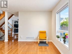 Markham (Berczy) apartment for rent - A room with a yellow chair and a window.