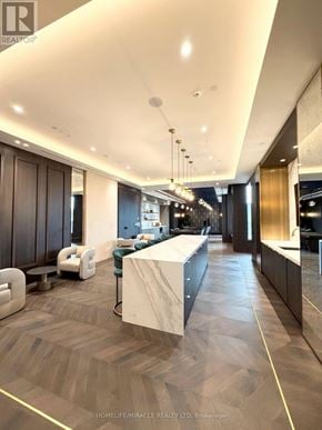 Vaughan (Vaughan Corporate Centre) condo for rent - A modern office lobby with a reception desk and seating area.