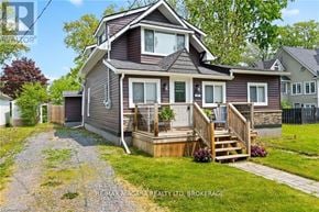 Fort Erie (Crystal Beach) apartment for rent - A house with a brown roof and a deck in front.