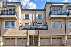 Vaughan (Maple) townhouse for rent - A building with balconies and garages is labeled as a brokerage.
