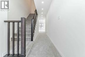 Brantford townhouse for rent - A hallway with a staircase on the left side.