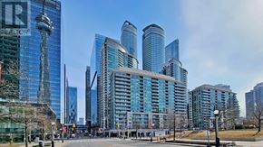 Toronto (Waterfront Communities) condo for rent - A cityscape with tall buildings and a clear sky.