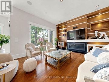 Toronto (Newtonbrook East) apartment for rent - A living room with a glass coffee table and a white couch.