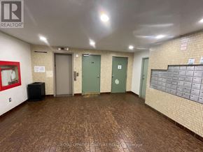 Toronto (Morningside) townhouse for rent - A hallway with a Royal LePage Signature Realty Brokerage logo on the wall.