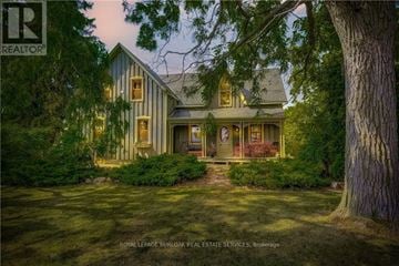 Hamilton apartment for rent - A house with a lawn and trees in front of it.
