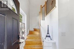 St. Catharines (Haig) apartment for rent - A staircase with a small Eiffel Tower statue on the landing.