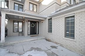 Brampton (Sandringham-Wellington) apartment for rent - A house with a black door and a wreath on it.