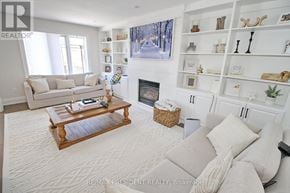 Brampton (Sandringham-Wellington) apartment for rent - A living room with a fireplace and a couch.