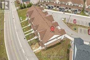 Cambridge townhouse for rent - An aerial view of a residential area with a red marker on one of the houses.