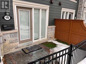 Mississauga (Churchill Meadows) townhouse for rent - A house numbered 102 with a mailbox and a black fence.
