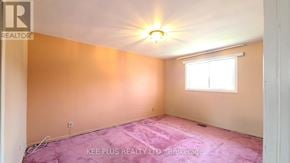 Toronto (Morningside) apartment for rent - A room with a window and a ceiling light.