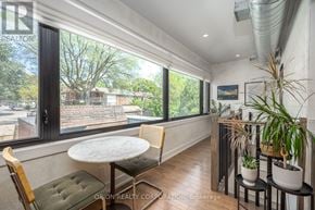 Toronto (Oakwood Village) multi-family for rent - A sunny balcony with a table and chairs.