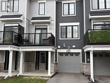Ottawa townhouse for rent - A building with the sign REMAX HALLMARK REALTY GROUP. BROKERAGE.