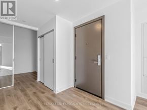 Hamilton (Beasley) condo for rent - A room with a wooden floor and a brown door.