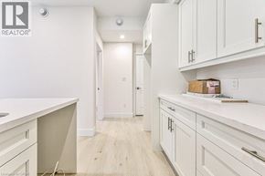 Kitchener apartment for rent - A white kitchen with a box on the counter.
