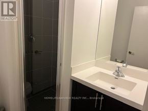 Toronto (Yorkdale-Glen Park) condo for rent - A bathroom with a sink, mirror, and shower.