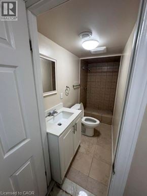 Hamilton apartment for rent - A bathroom with a toilet, sink, and shower.