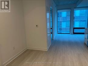 Toronto (Moss Park) condo for rent - A room with a door leading to a balcony.