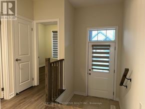 Kawartha Lakes (Bobcaygeon) townhouse for rent - A white door with a window above it in a room.